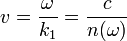 v=\frac{\omega}{k_1}=\frac{c}{n(\omega)}